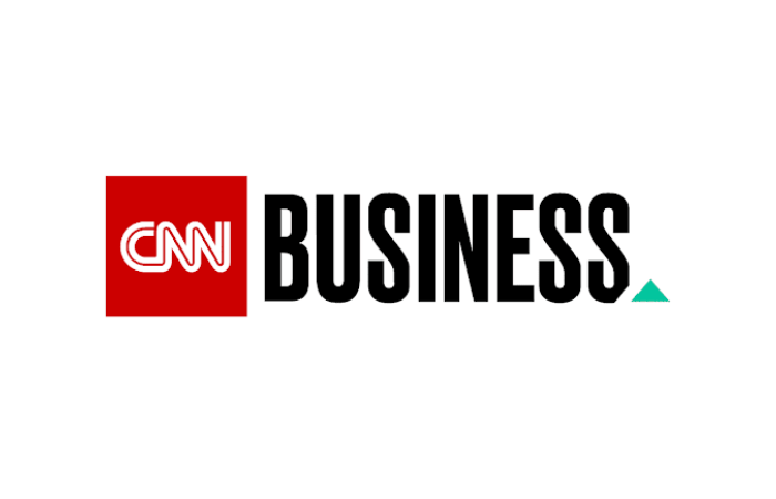 red box with "CNN" in white on the left and "business" in black letters with a small green triangle after the last "s" like a period
